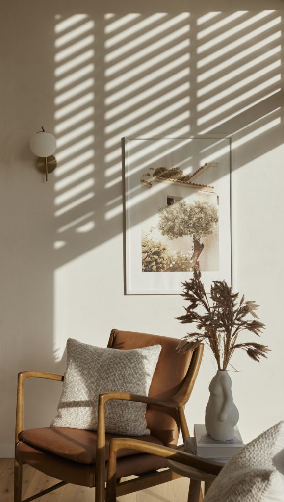 Amanda Aitken photography work for Design Builders. Image of chair with filtered sunlight 