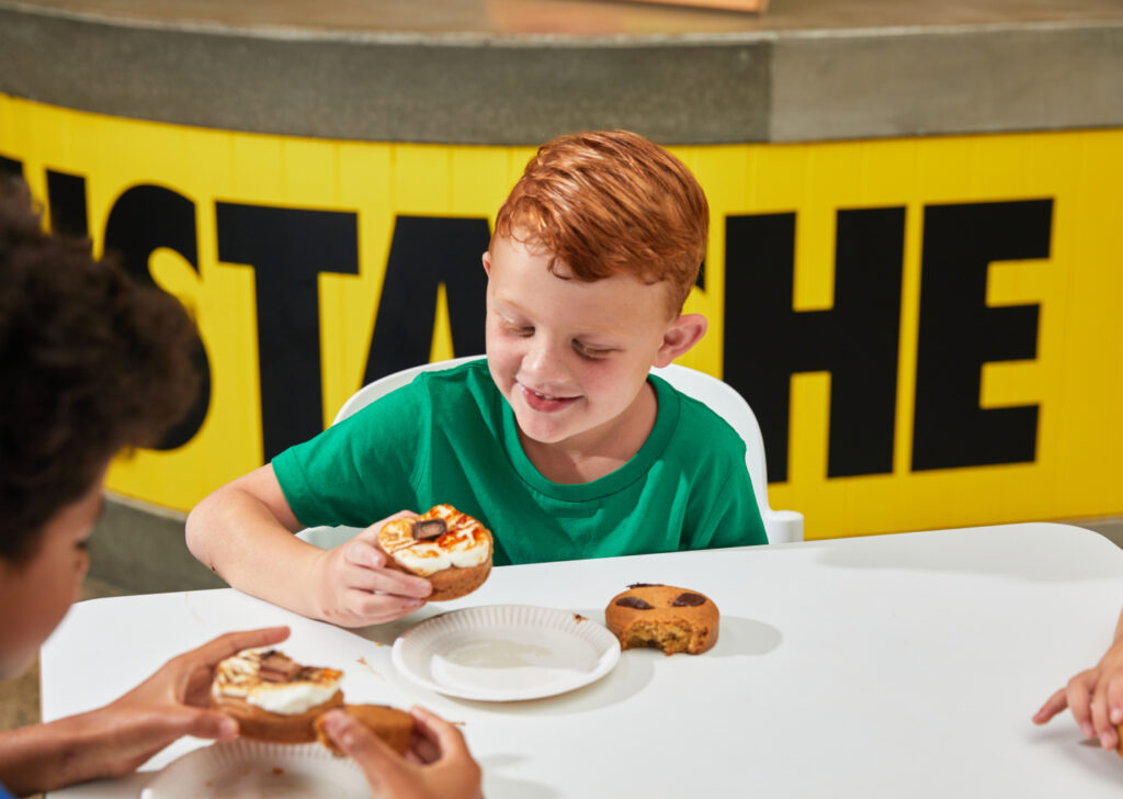 Image of children enjoying one of Moustache's cookie pies. 