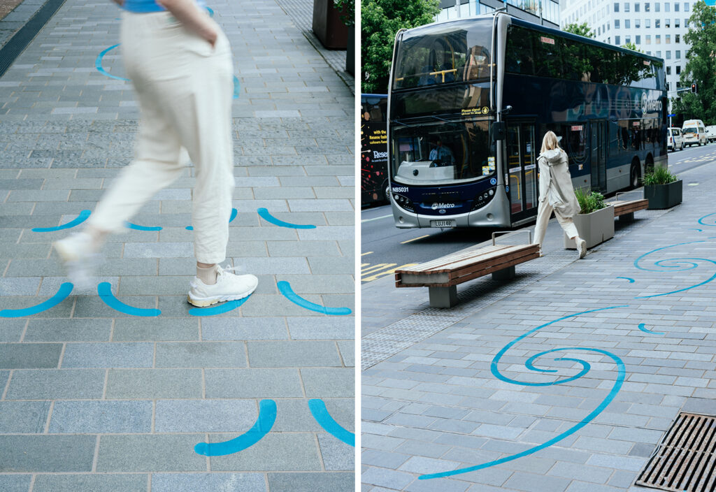 Two photos of the Waihorotiu Path. Image on the left is a detail shot of the blue swirl design on the brick with a woman walking across it. Image two is a wider shot showing the blue swirling detail down the sidewalk and how it fits into the busy urban street. 